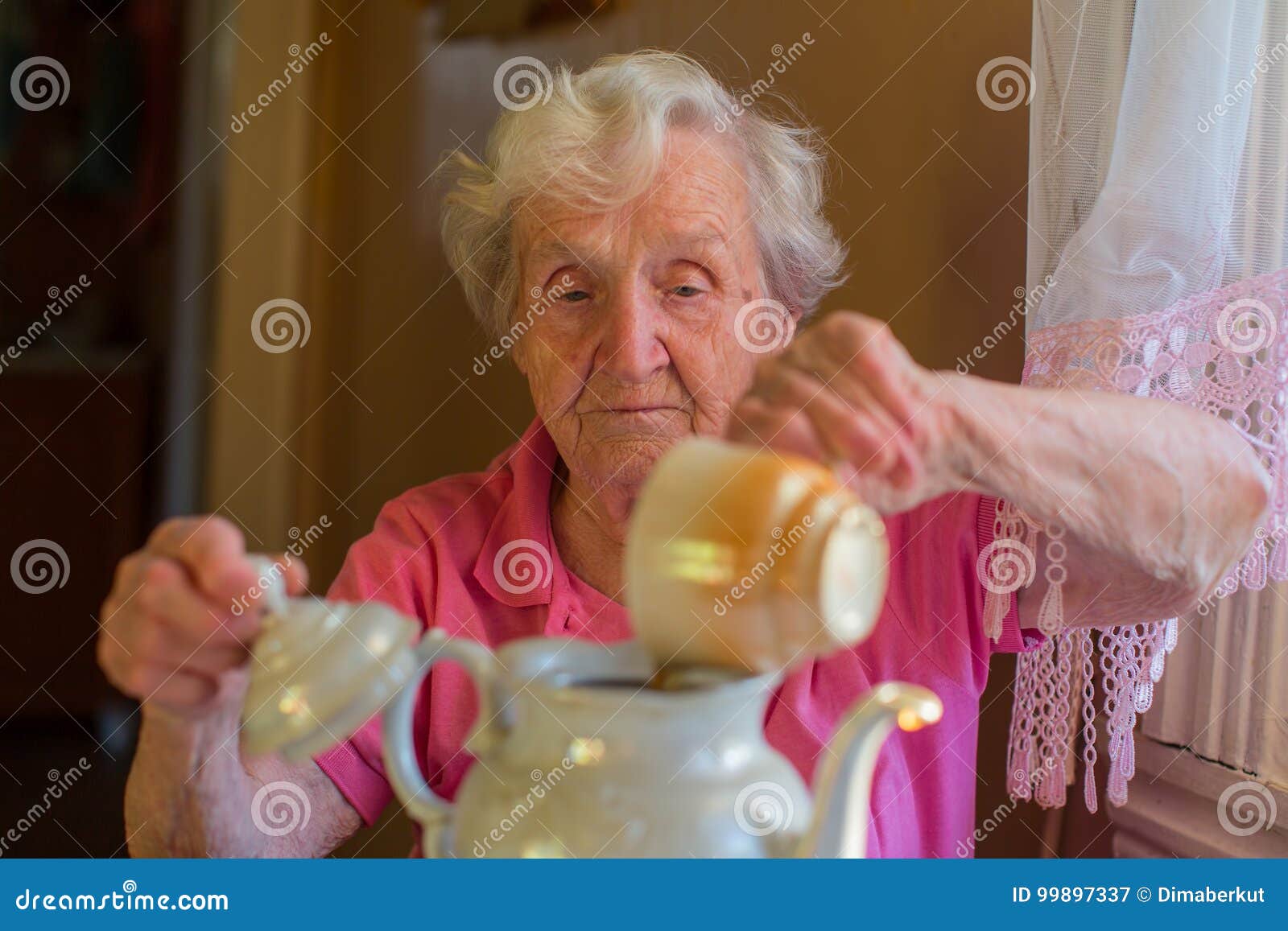 Elderly Happy Woman Making Tea in the Kettle. Stock Image Image of