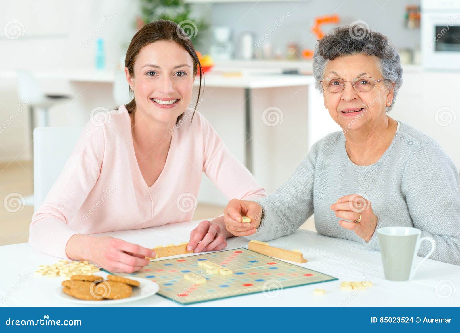 Elderly Woman Playing Board Game Stock Photo Image of sitting, girl