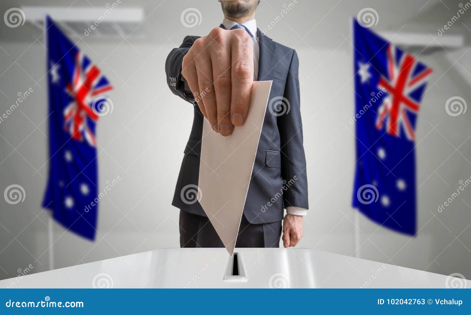 Election or Referendum in Australia. Voter Holds Envelope in Hand Above