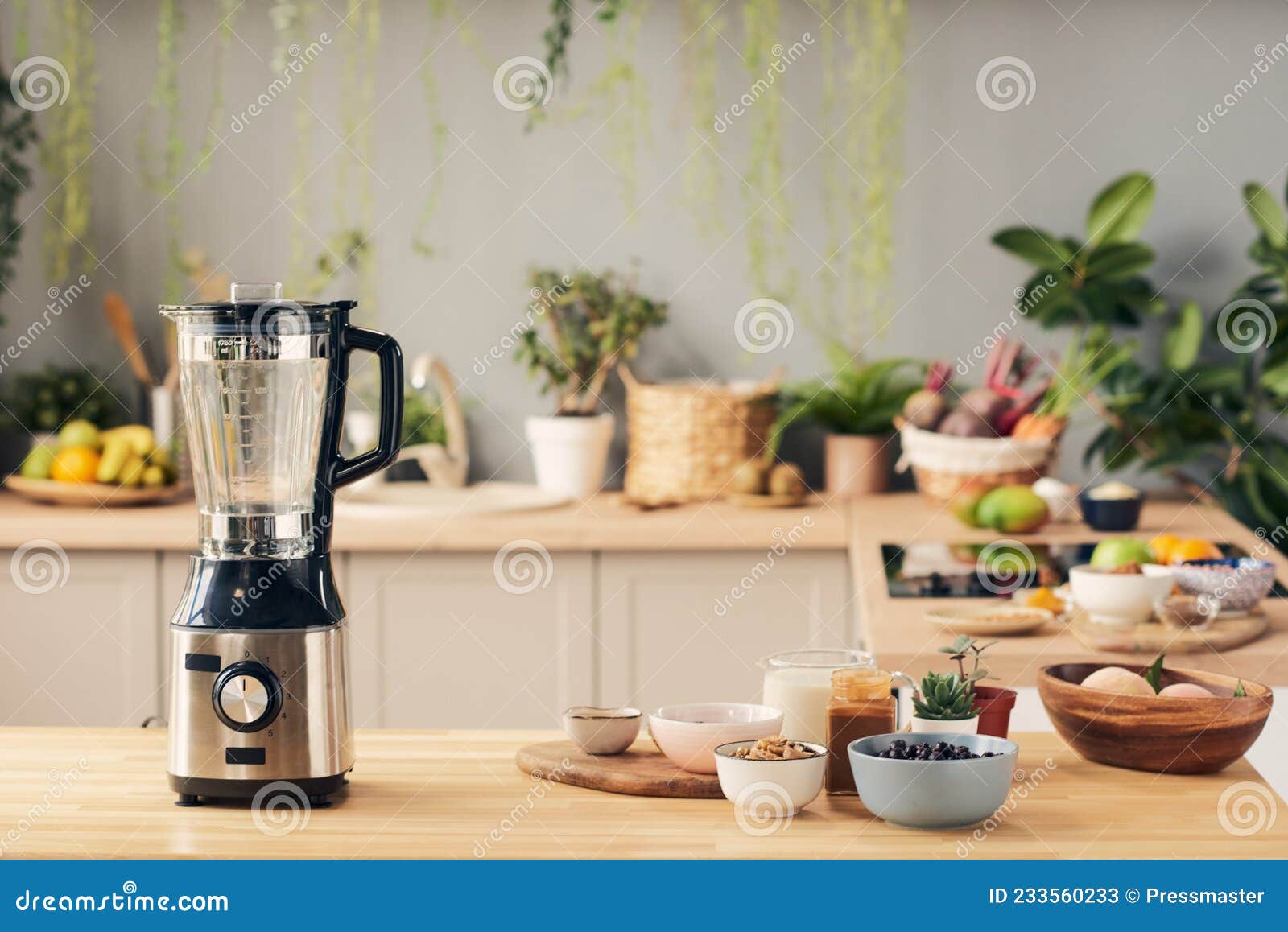 Woman in orange dress pouring fresh milk into electric blender Stock Photo  by Pressmaster