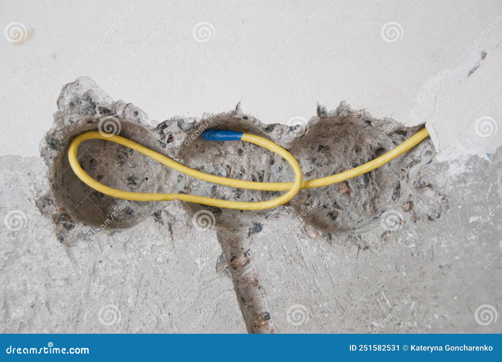 Electric Cable in Socket Hole in Cement Wall, Renovations Stock Image