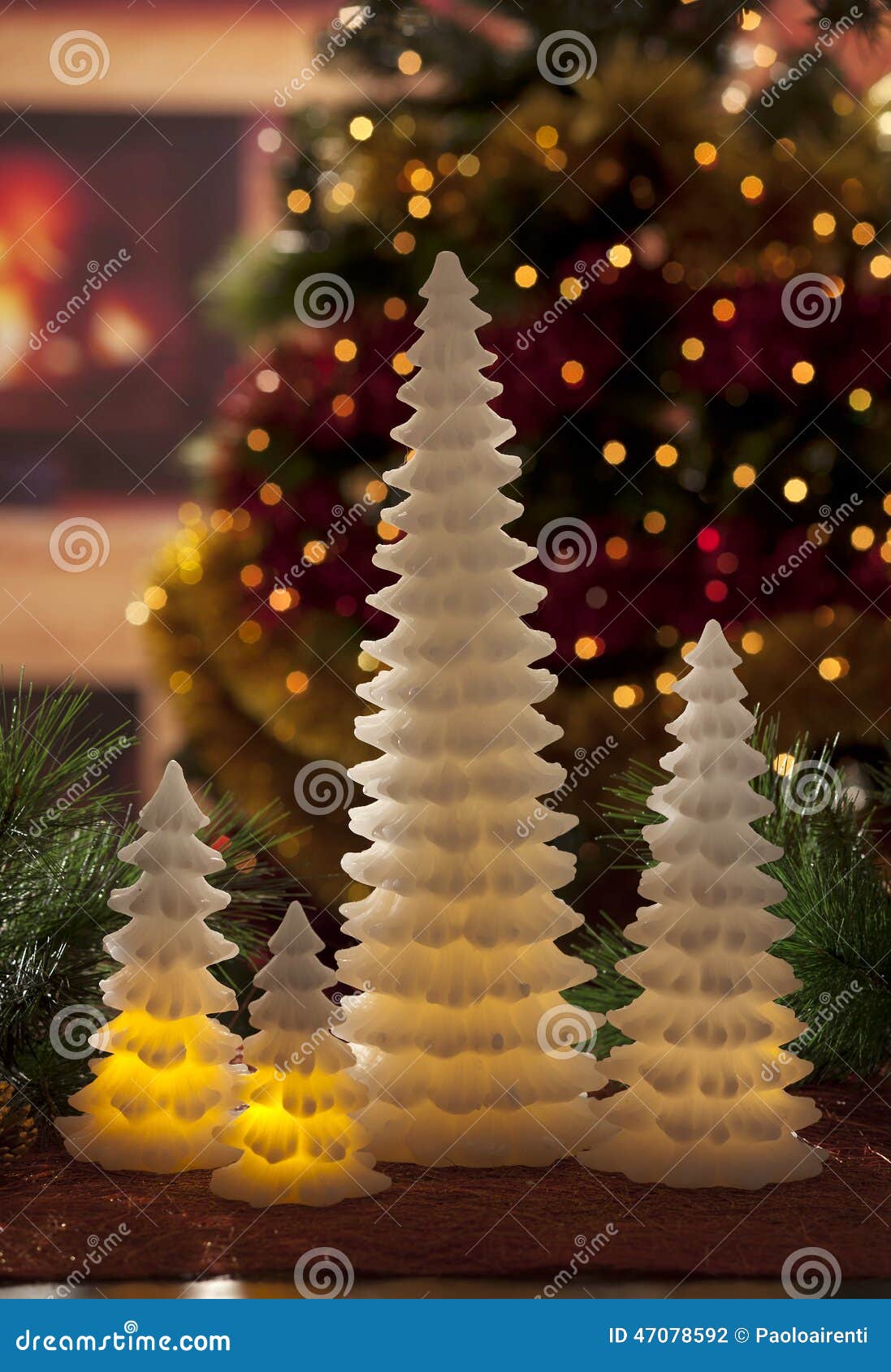 Electric Candles with Christmas Decorations in Atmospheric Light Stock