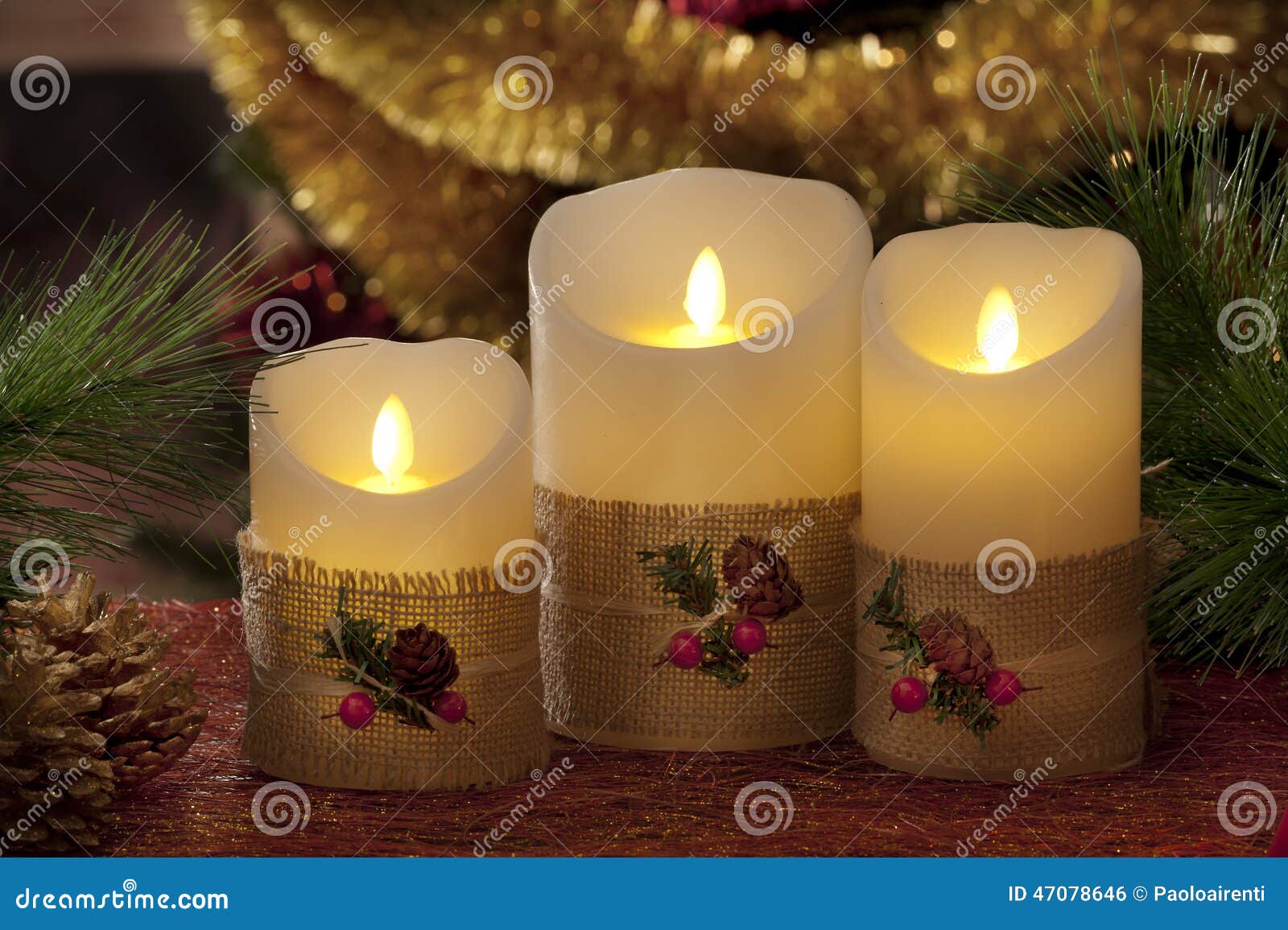 Electric Candles with Christmas Decorations in Atmospheric Light Stock