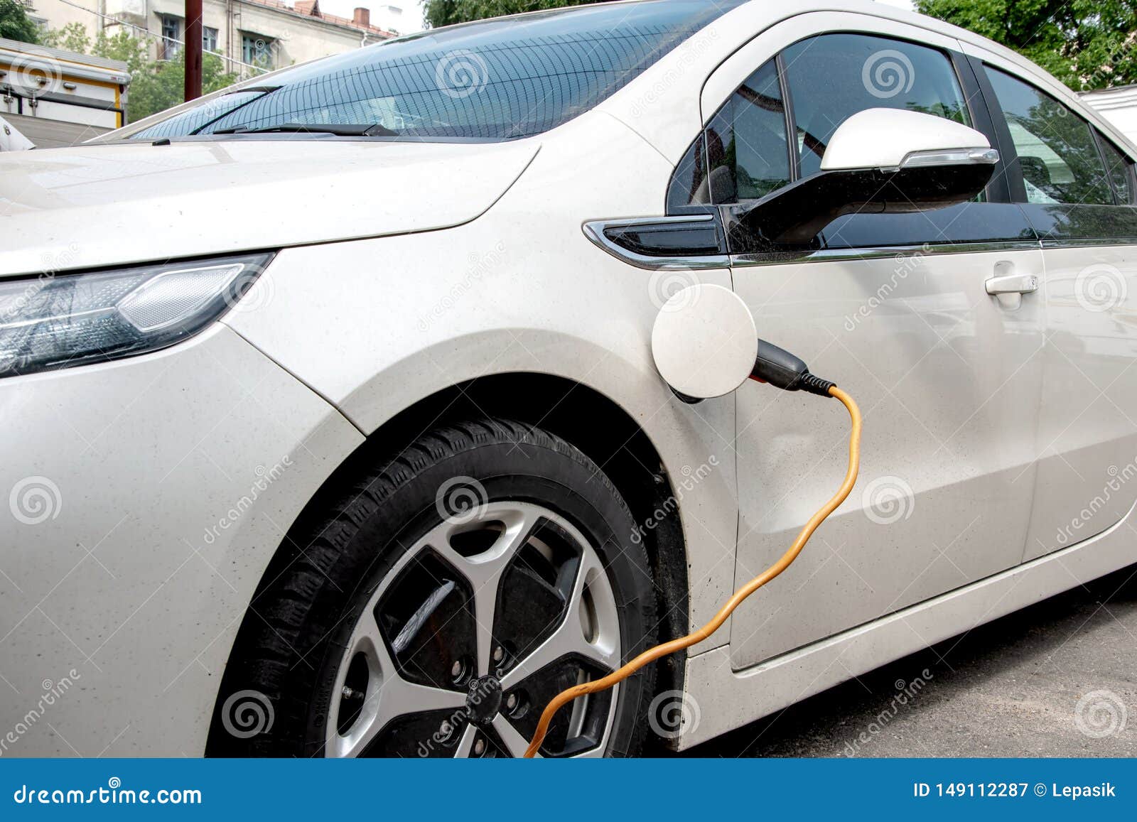 the electric car is charged from the mains, the cable from the charging station