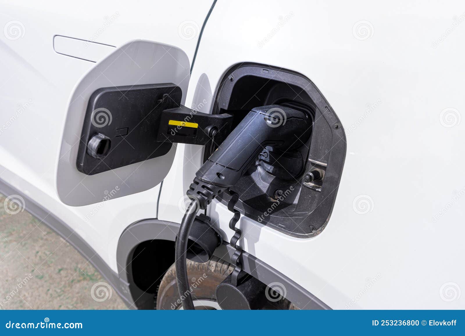 Electric Car Charging the Battery from the Electric Charger Stock Photo