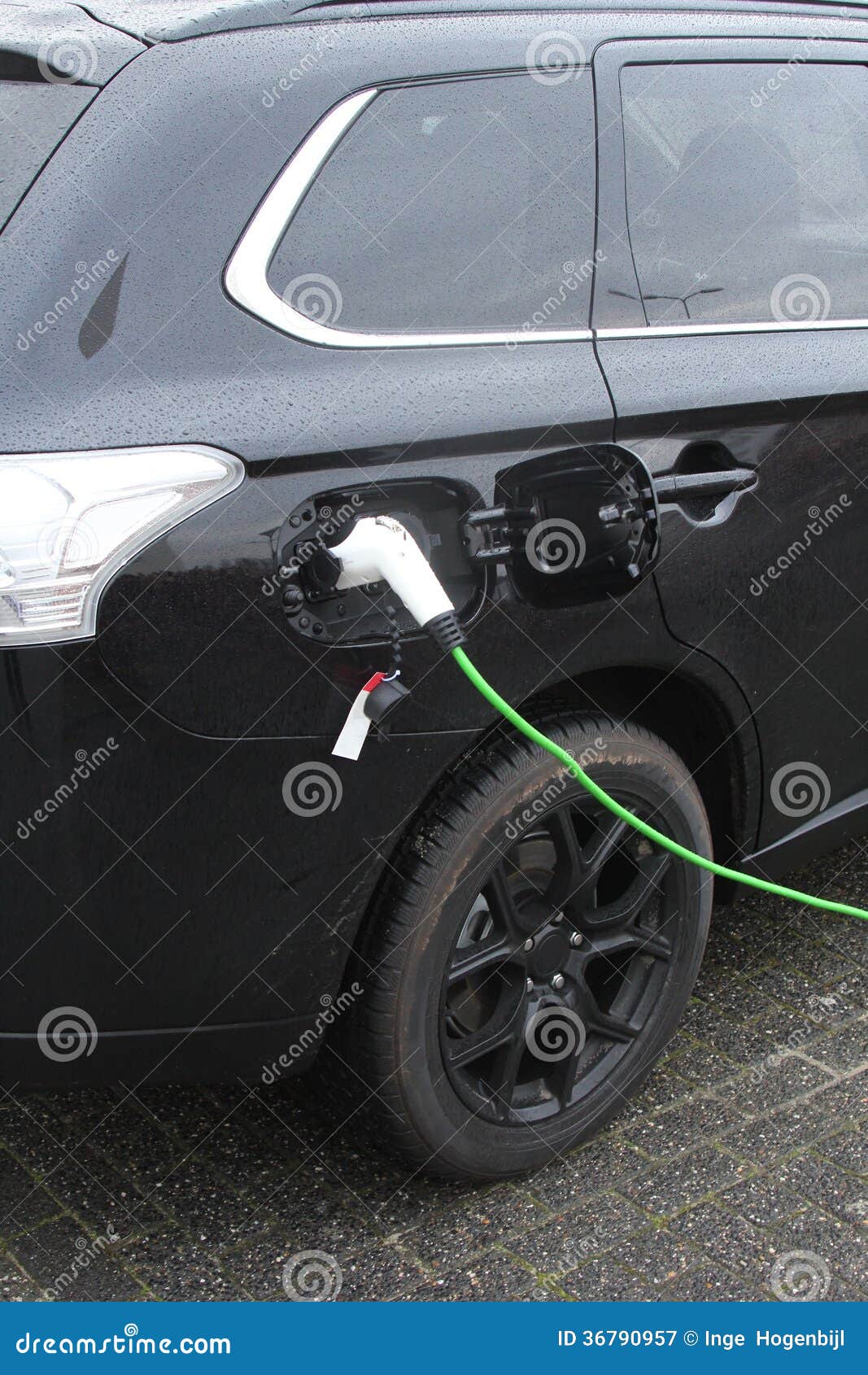 Modern Electric Plug Car Charges New Electric Energy, Netherlands Stock
