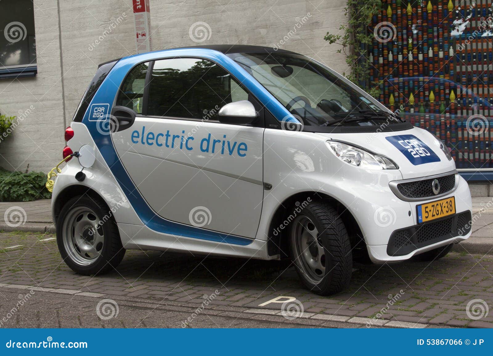 Electric Car at a Charging Point in the Streets of Amsterdam Editorial