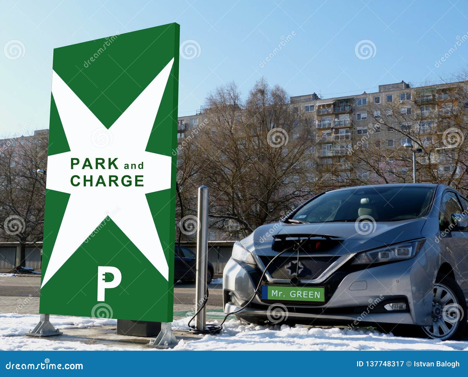Electric Car Charging Station in Green Parking Lot Stock Image - Image