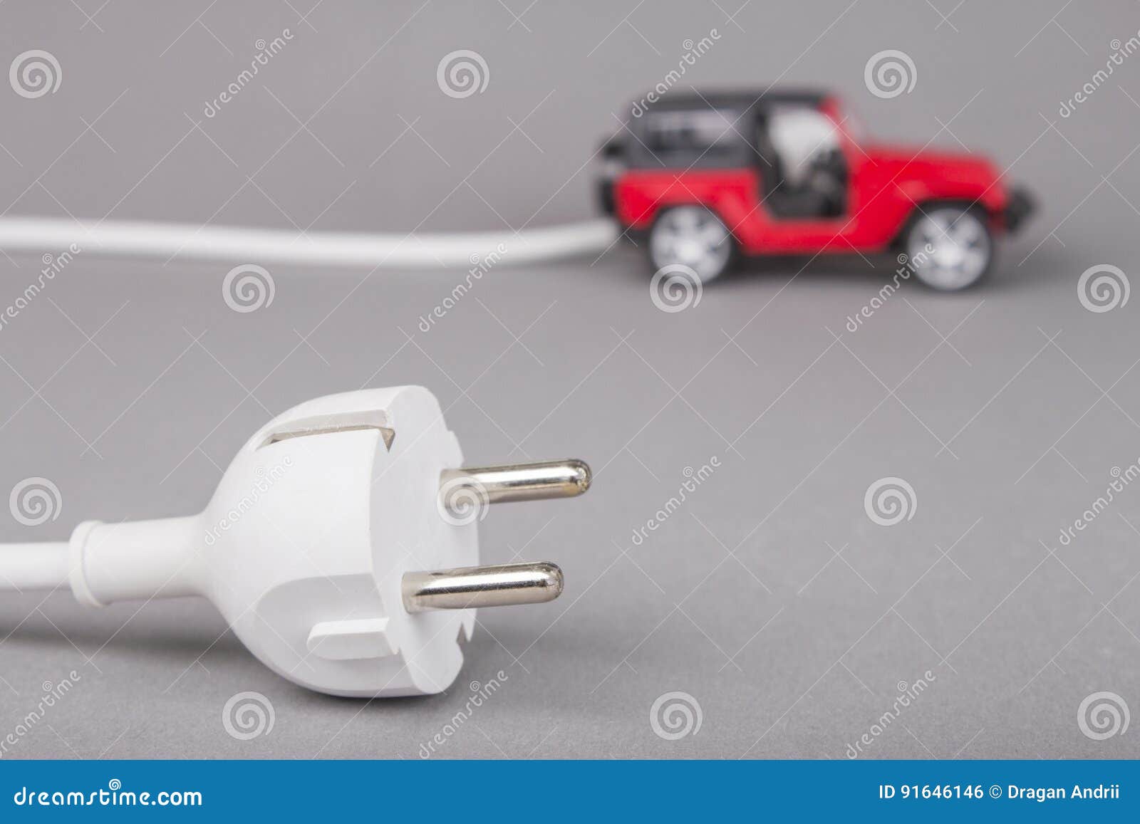 Electric Car with Plug from the Outlet. Stock Photo Image of electric