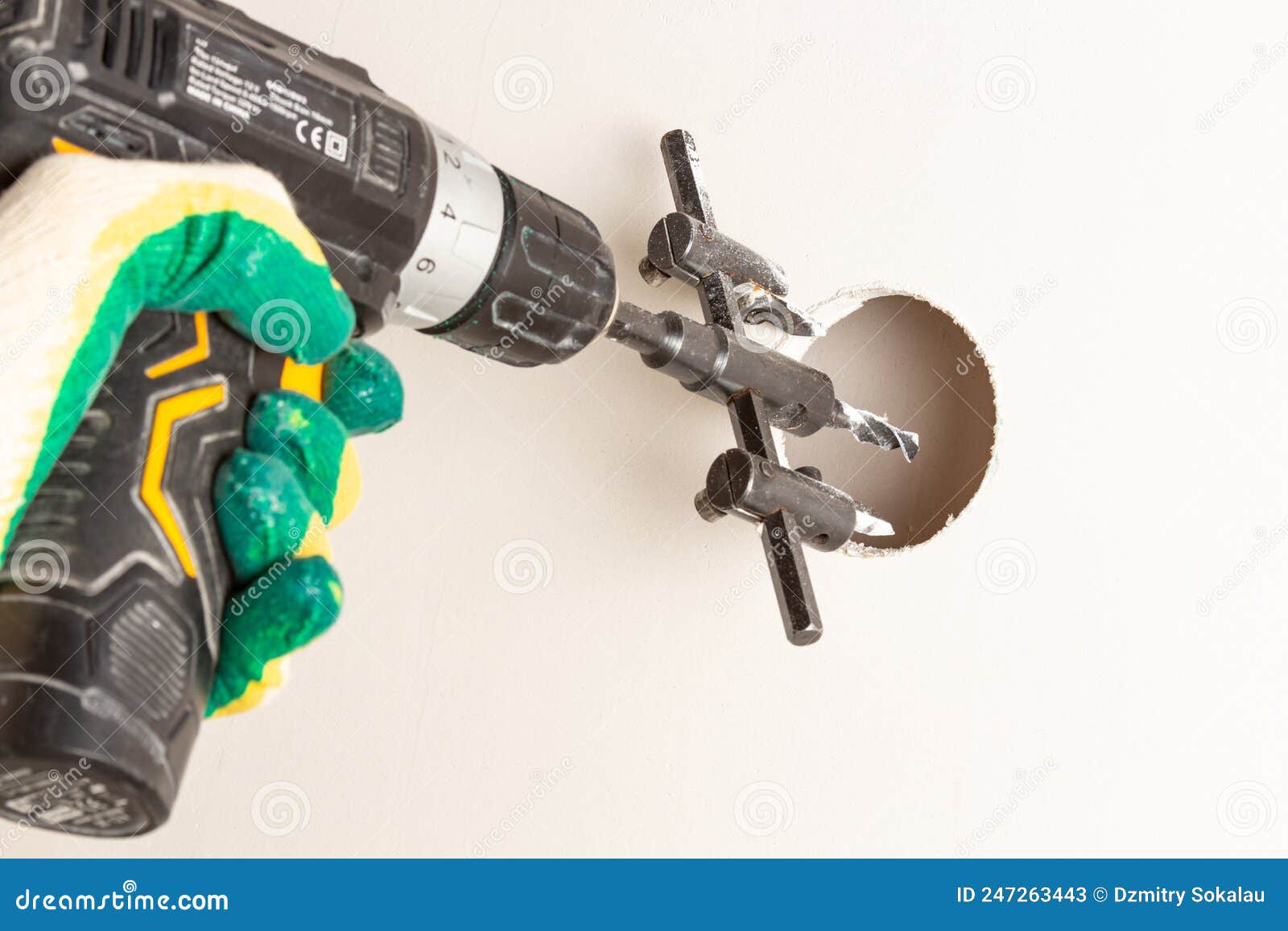 An Electric Drill Drills Holes in Drywall. Closeup Stock Image Image