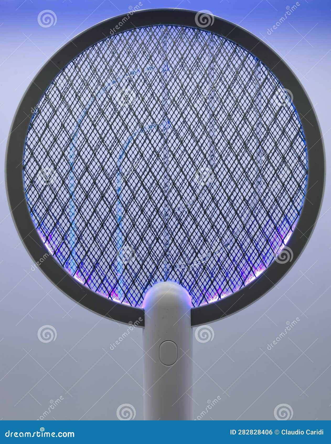 Electric Fly and Mosquito Swatter on Charging Base Switched on Stock