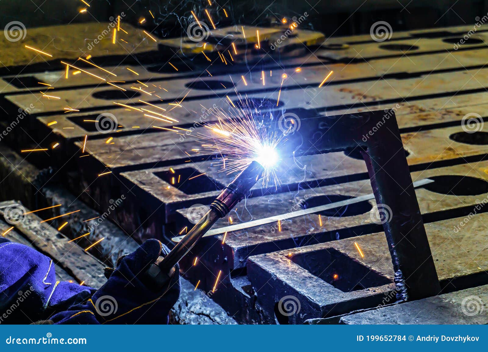 Electric Gas Welding in the Sparks from Welding Stock Photo