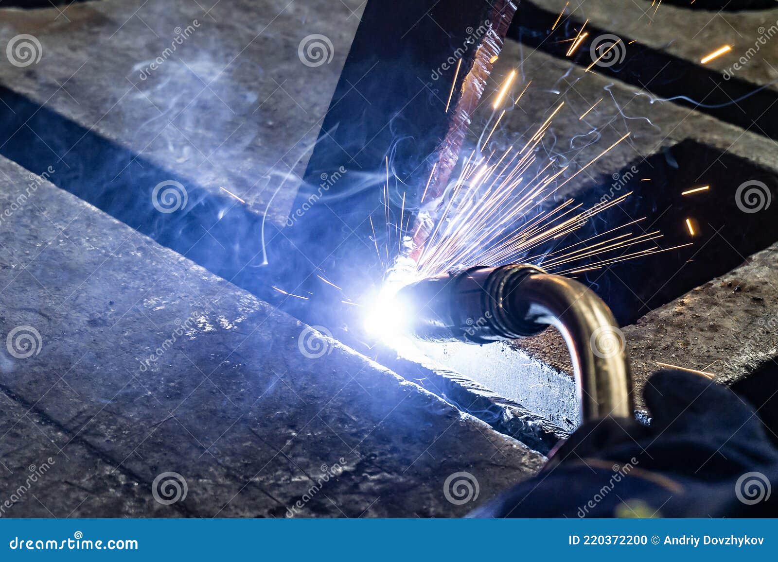 Electric Gas Welding in the Sparks from Welding Stock Photo
