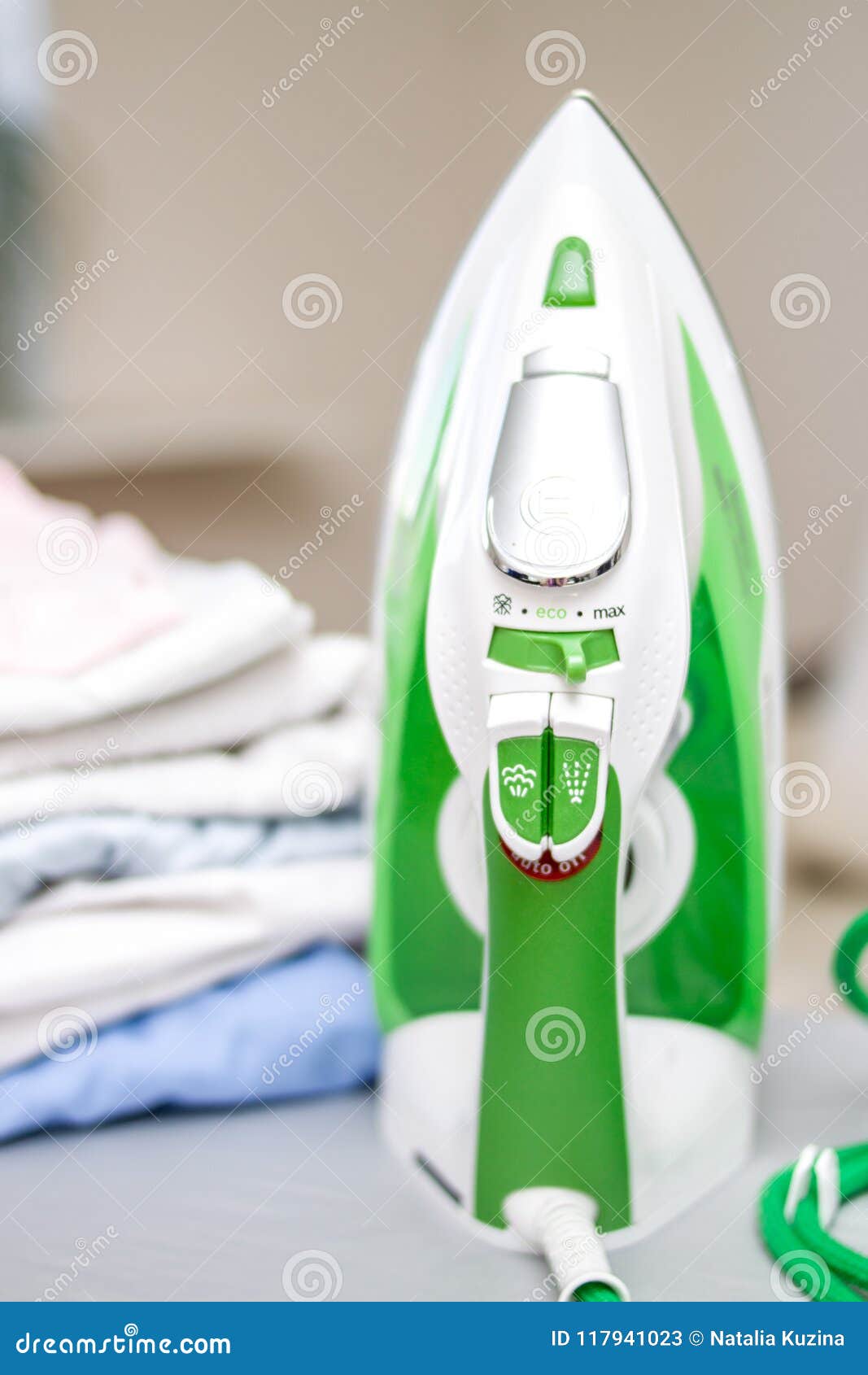 Iron and pile of clothes stock image. Image of beautiful 117941023