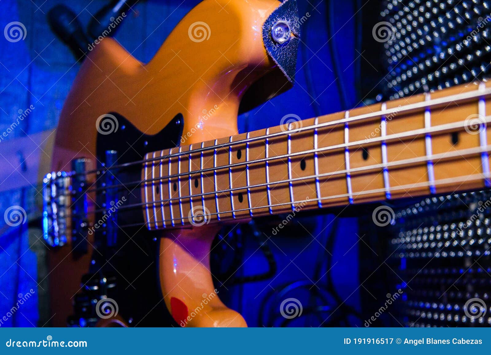 An Electric Guitar with a Blue Background Stock Image Image of scene