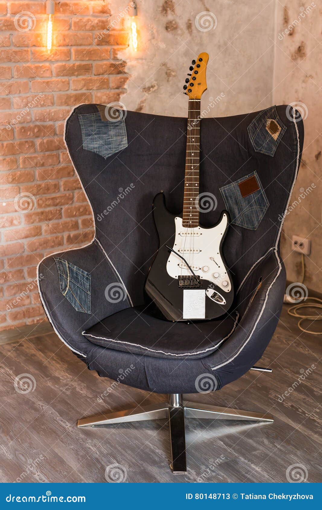 Electric guitar on a chair stock image. Image of texture 80148713