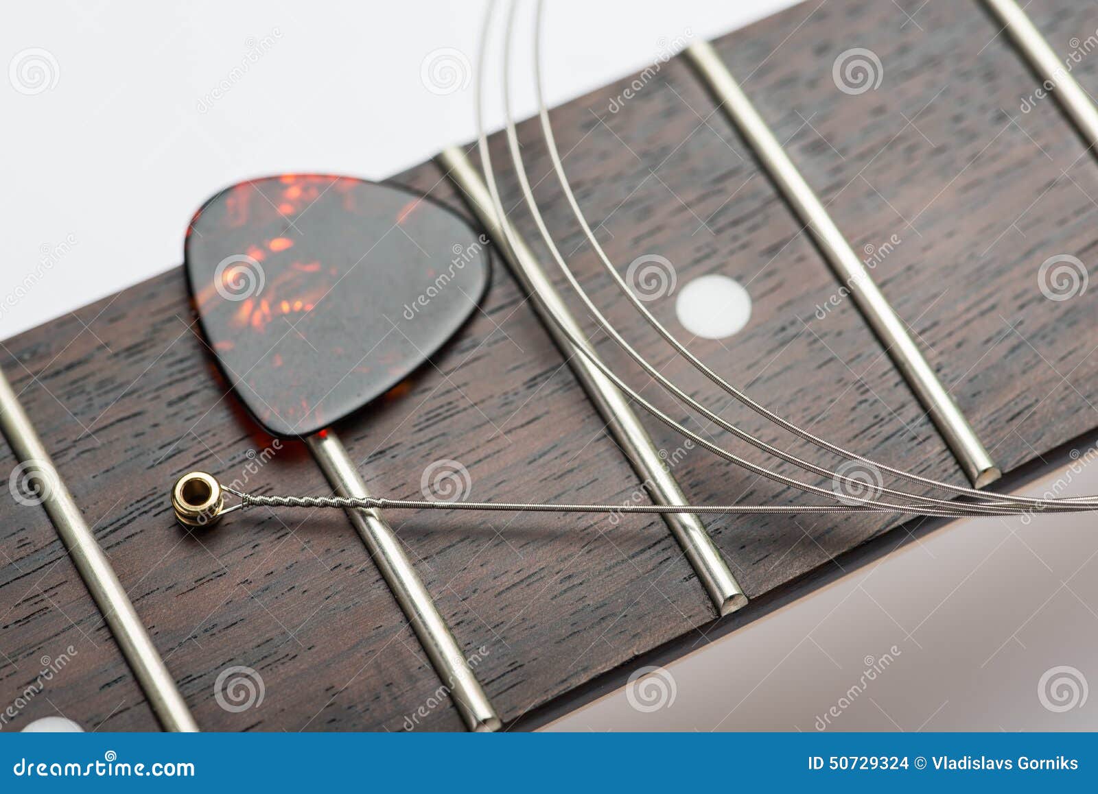 Electric Guitar Frets with String and Yellow Nippers Stock Photo