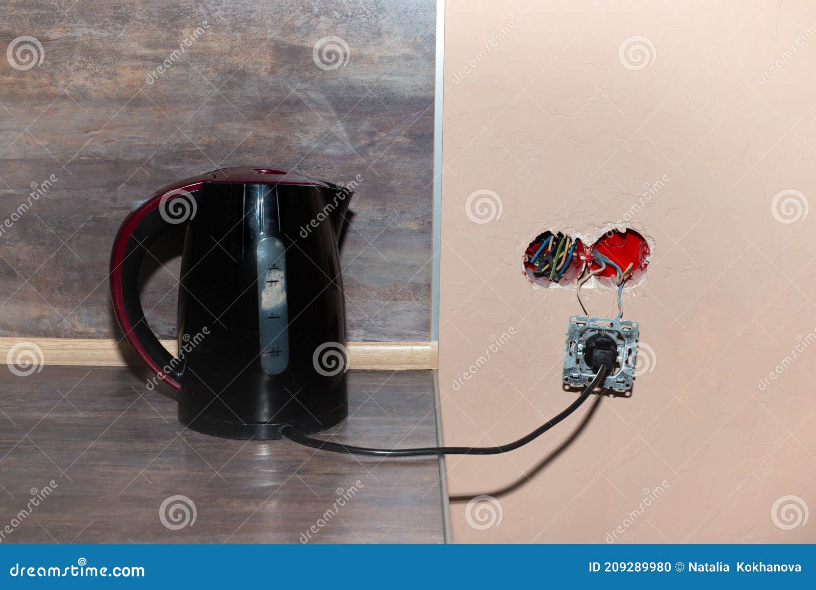 The Electric Kettle is Plugged into an Unfinished Broken Socket. Risk