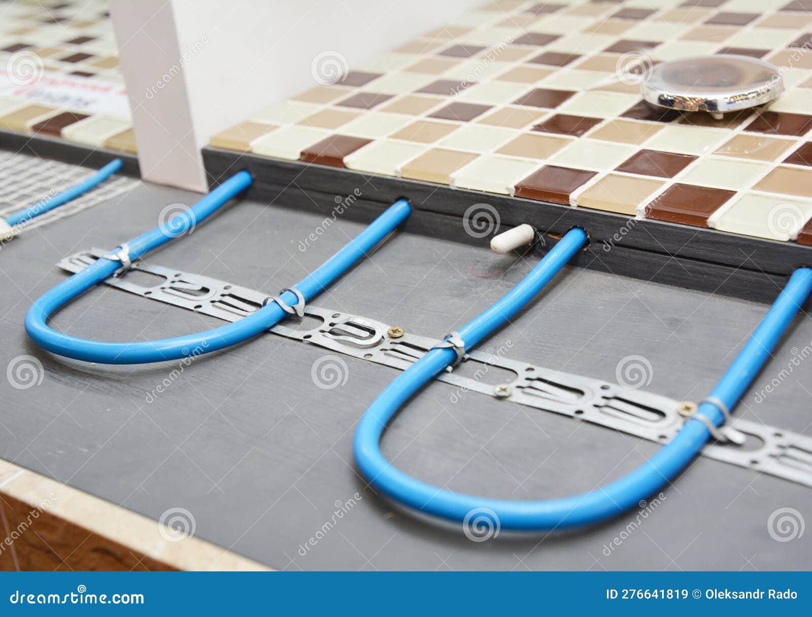 electric radiant flooring installation concept. installing radiant heat flooring or heated floor system in the bathroom during