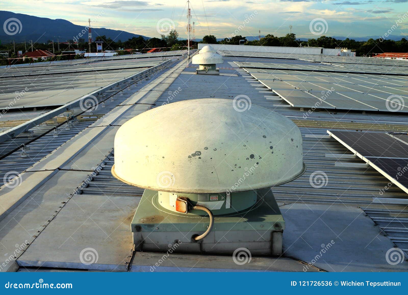 Electric Roof Ventilator Installed on Metal Sheet Roof Stock Photo