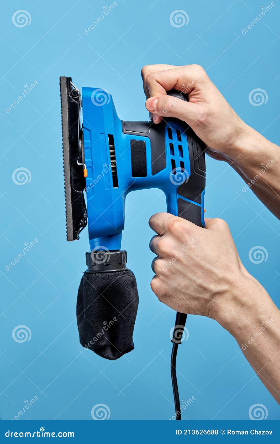 Electric Sanding Machine for Home Handyman Use, on Blue Background