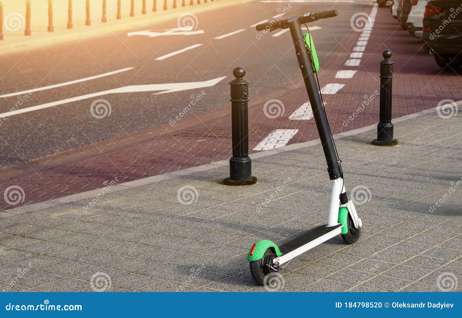 electric scooter parked on the road. modern eco electric city scooters for rent outdoors on the sidewalk. alternative transporte.