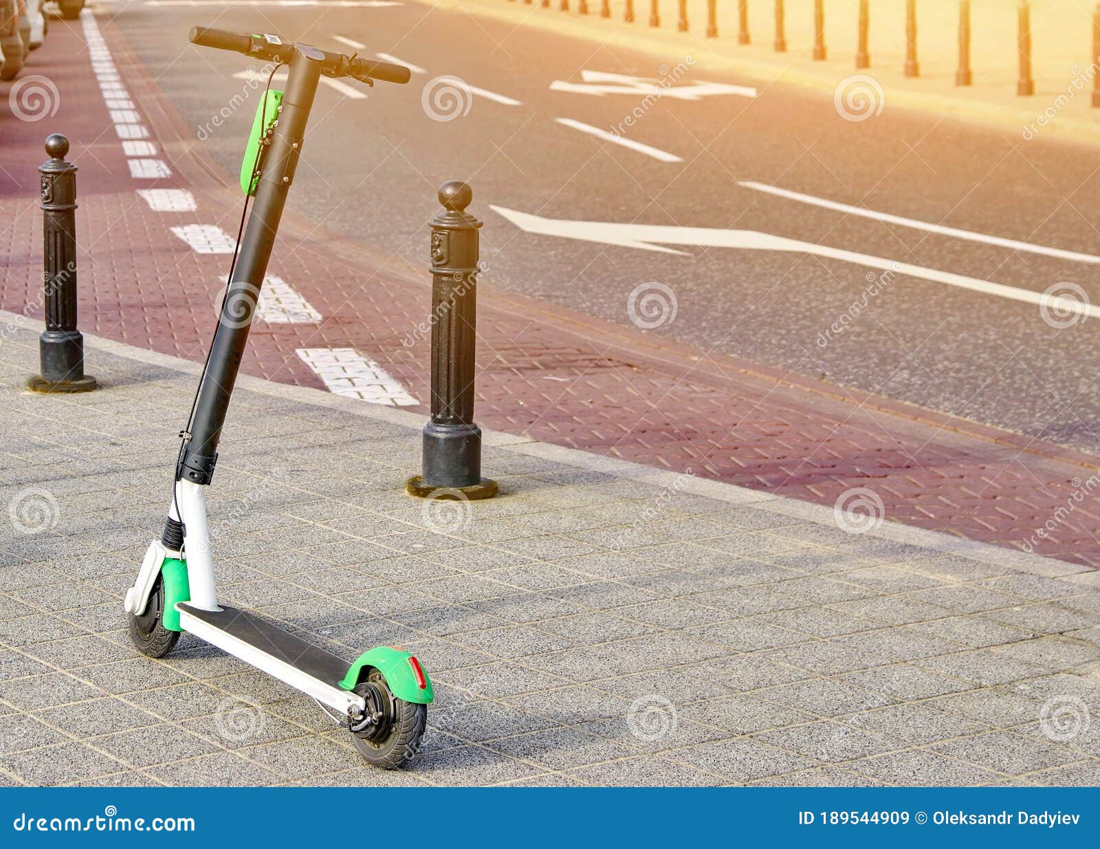 electric scooter parked on the road. modern eco electric city scooters for rent outdoors on the sidewalk. alternative transporte.