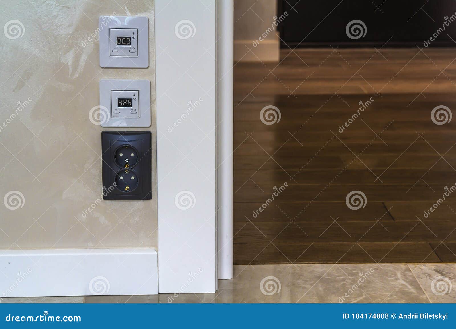 Electric Socket And Warm Floor Heater Control Panels On The Wall