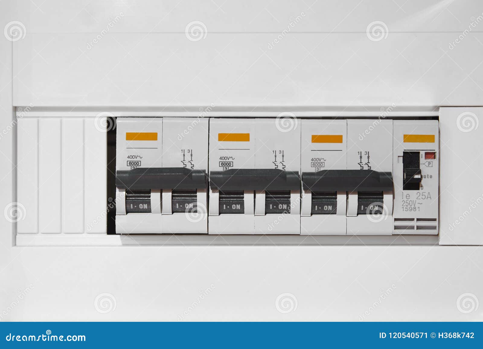 Electric Switchboard Control Over a White Wall. Electrical Devices