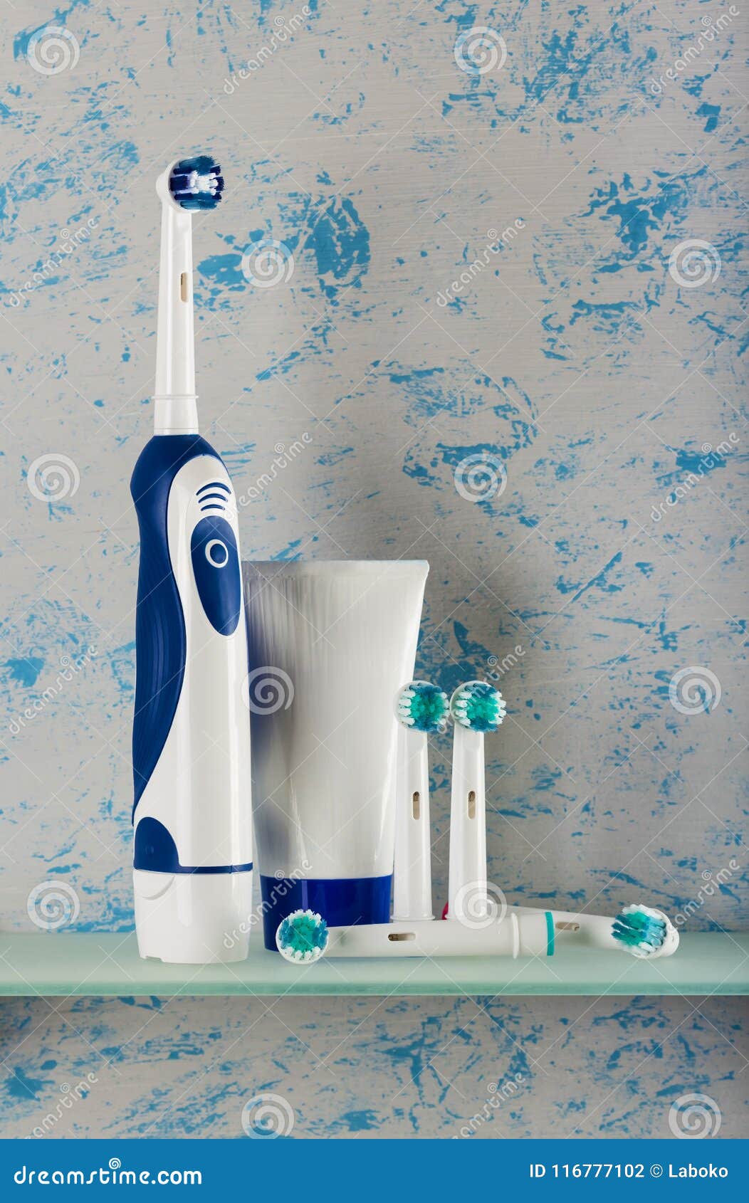 Electric Toothbrush with Interchangeable Tips, and Toothpaste, on Shelf