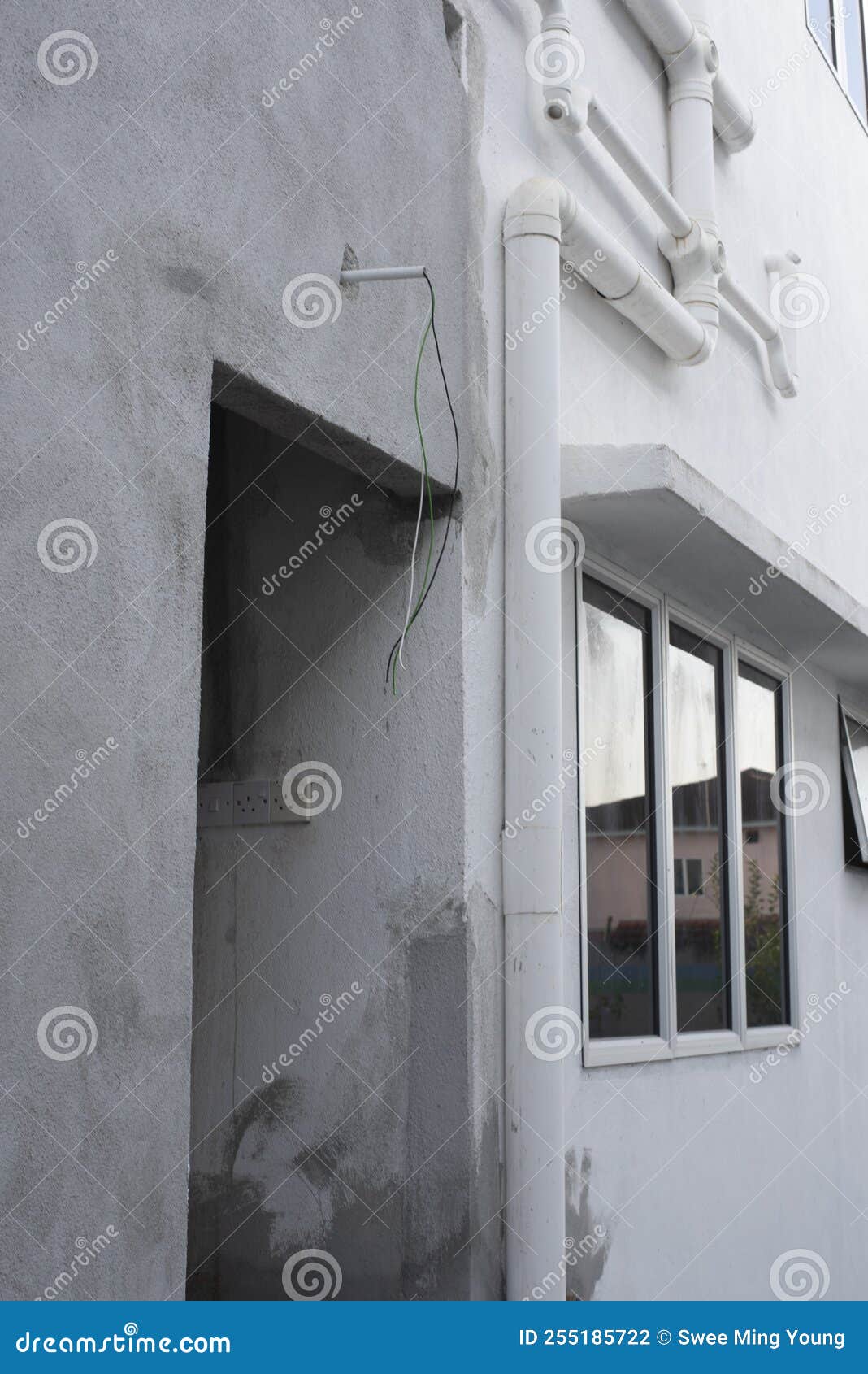 3 Electric Wires Laying Out from the Concrete Wall Stock Photo Image