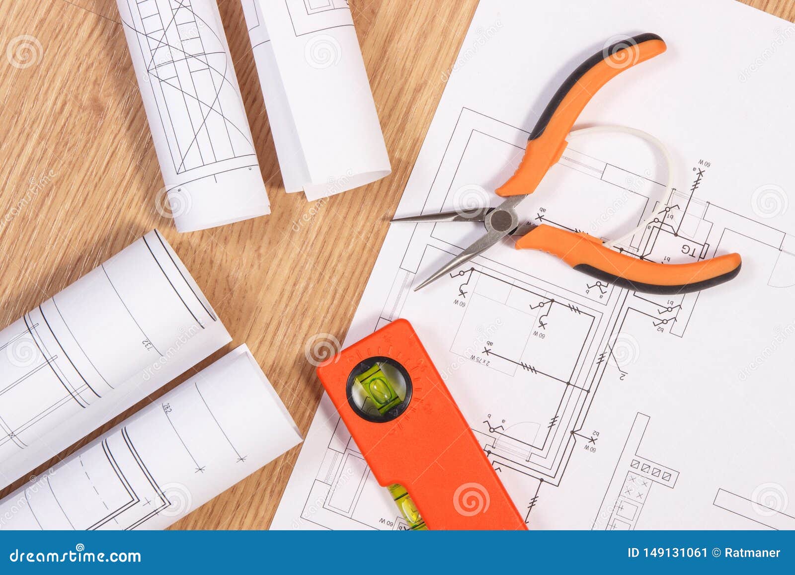 Electrical Blueprints or Diagrams and Orange Work Tools for Use in