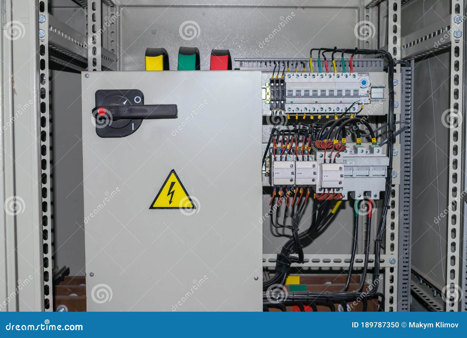 electrical cabinet containing a plurality of contacts and switches