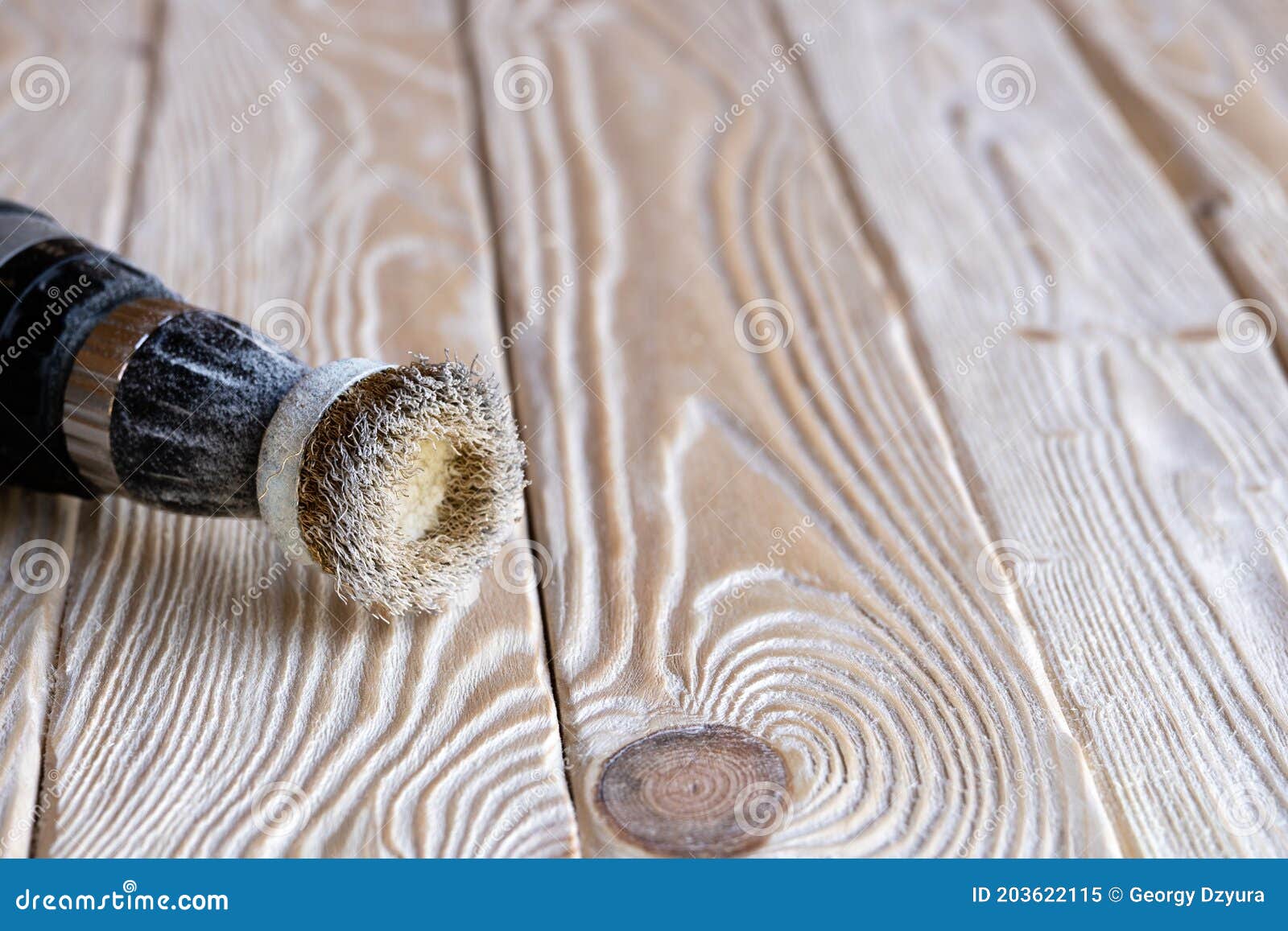 Electrical Drill with a Circular Metallic Wire Brush Lying on the