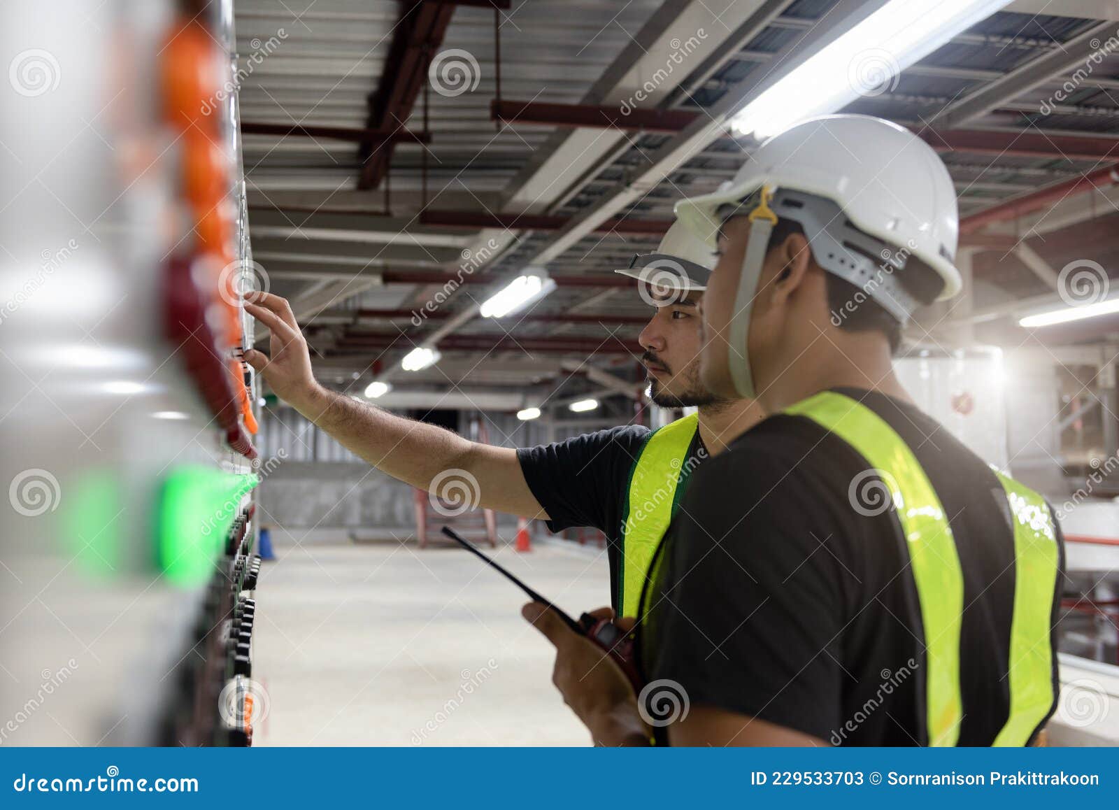 Electrical Engineer Checking Electrical Installations Front of a