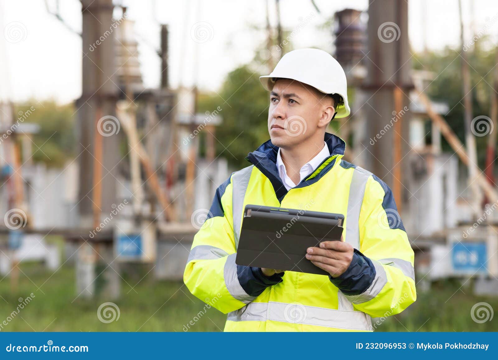 Electrical Engineer with High Voltage Electricity Pylon. an Energy Engineer Man in Special