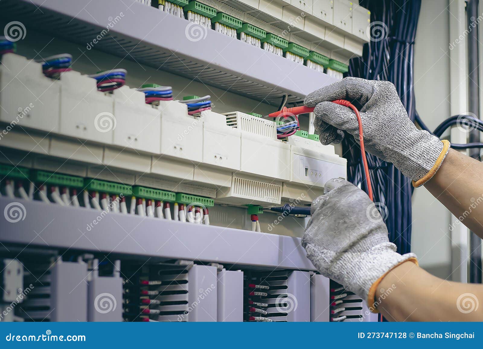 An Electrical Engineer is Inspecting the Operation of an Electrical
