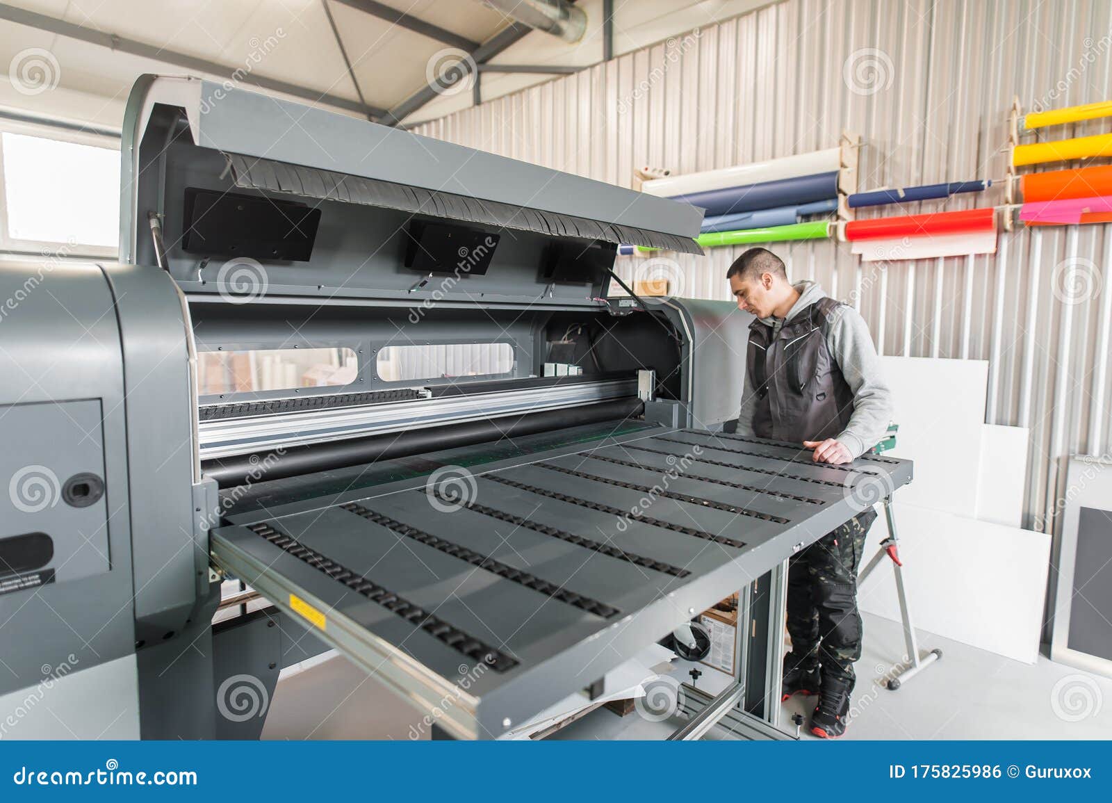 Electrical Engineer Operator Repairs Large Industrial Printer and