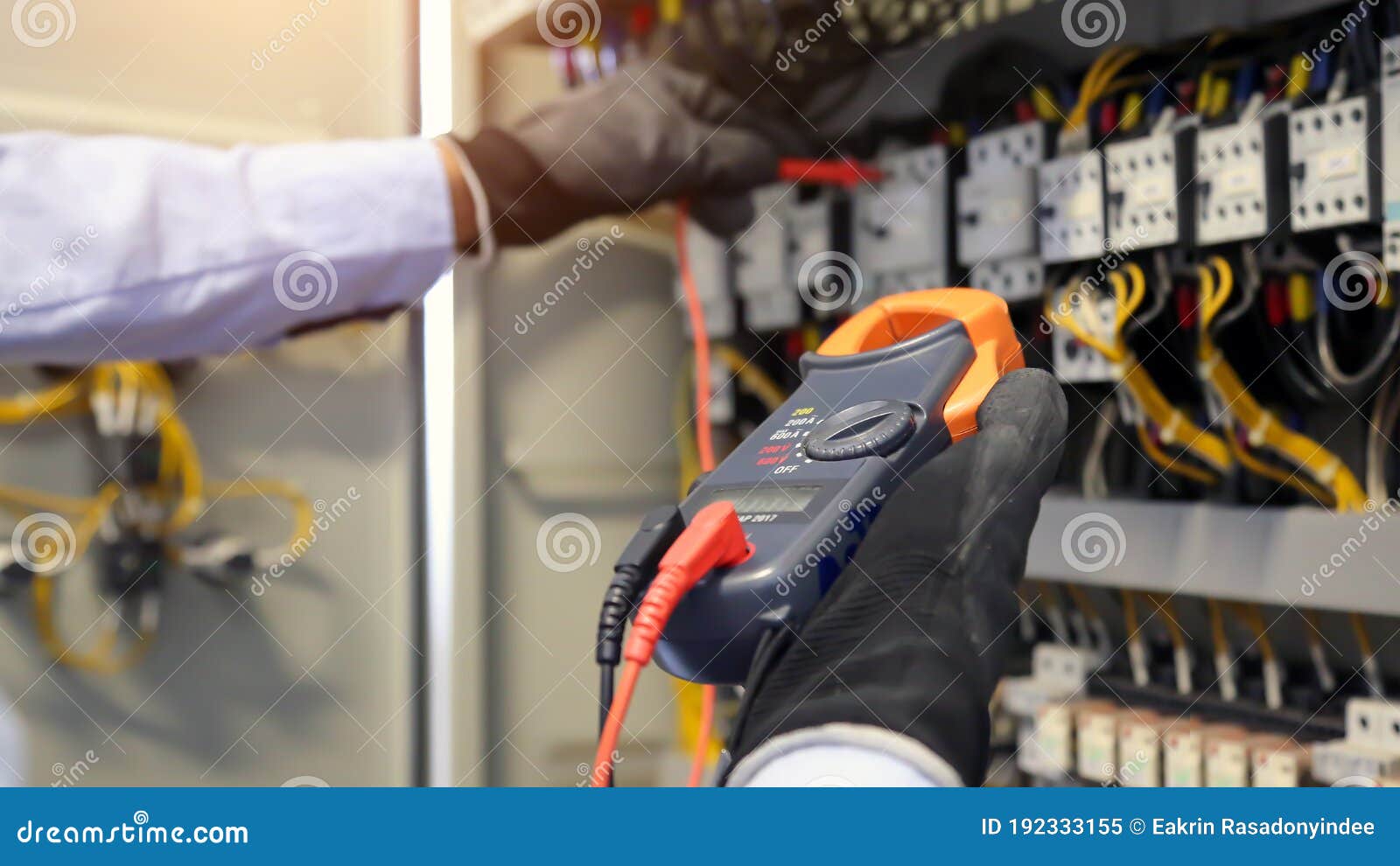 Electrical Engineer Using Digital Multimeter Measuring Equipment To