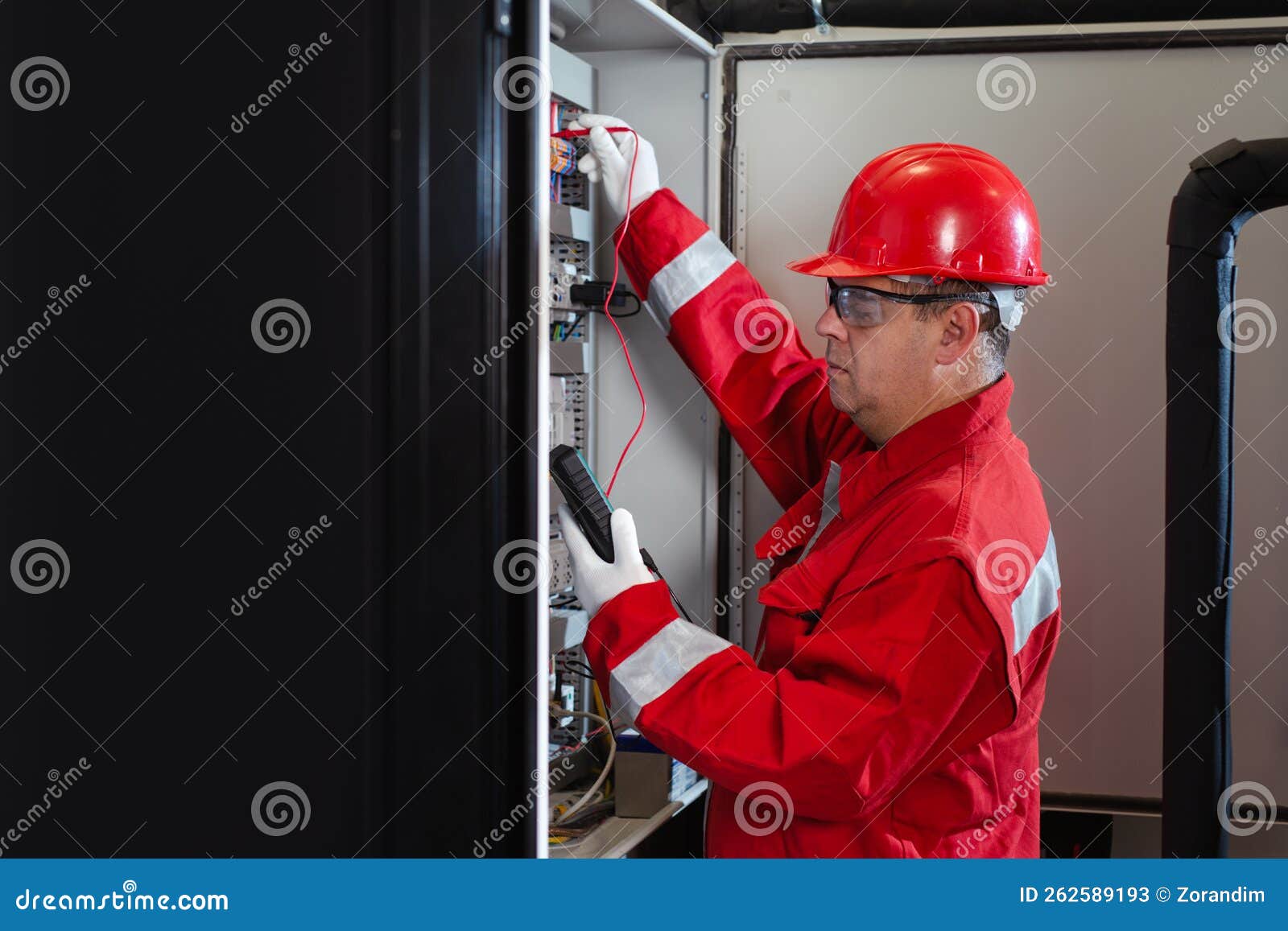 Electrical Engineer Using Digital Multimeter Measuring Equipment To