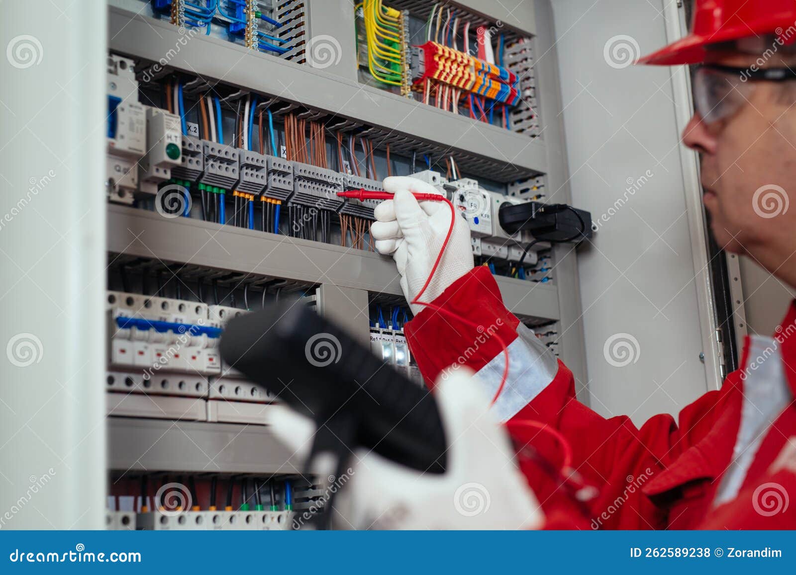 Electrical Engineer Using Digital Multimeter Measuring Equipment To