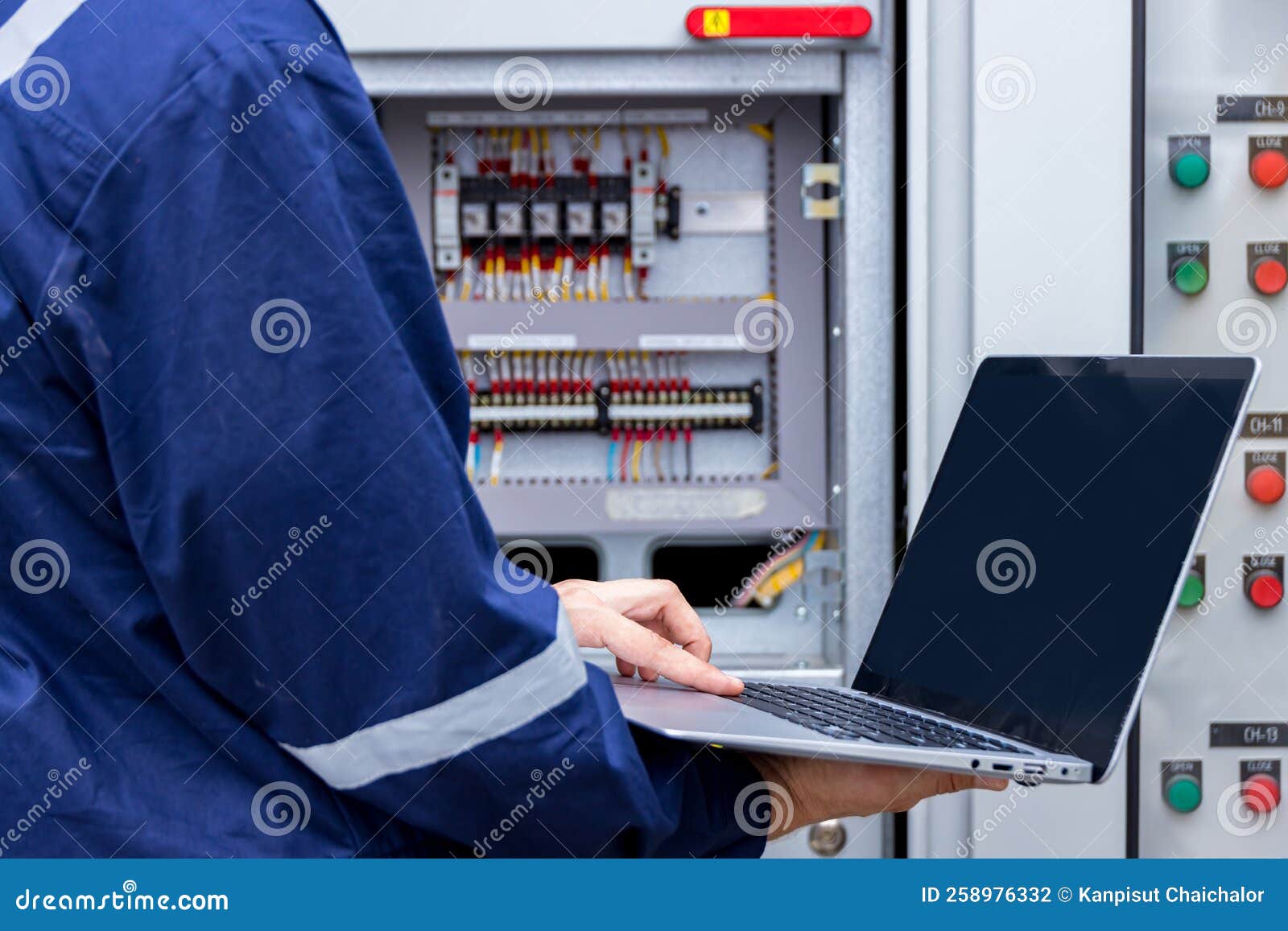 Electrical Engineer or Worker Working with Use Laptop Near Power