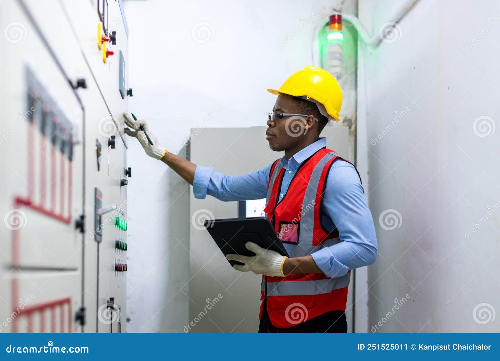 Electrical Engineer Working in Control Room. Electrical Engineer Man
