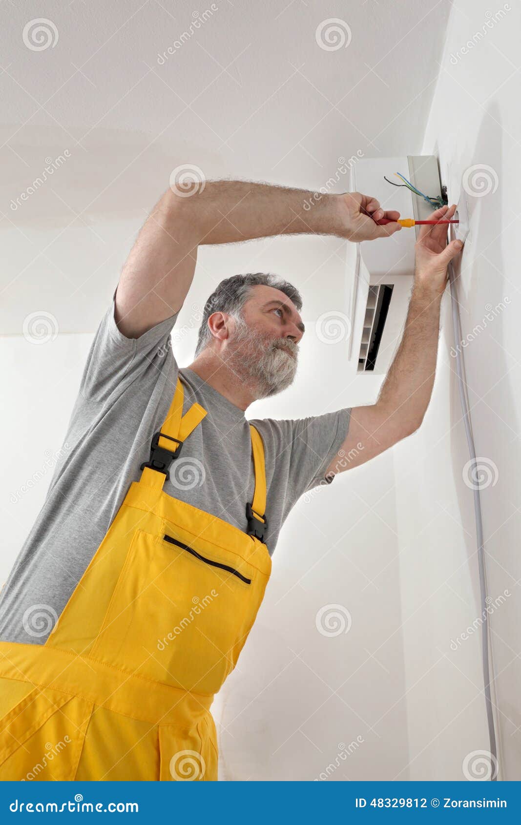 Electrical Installation of Air Conditioner, Electrician at Work Stock