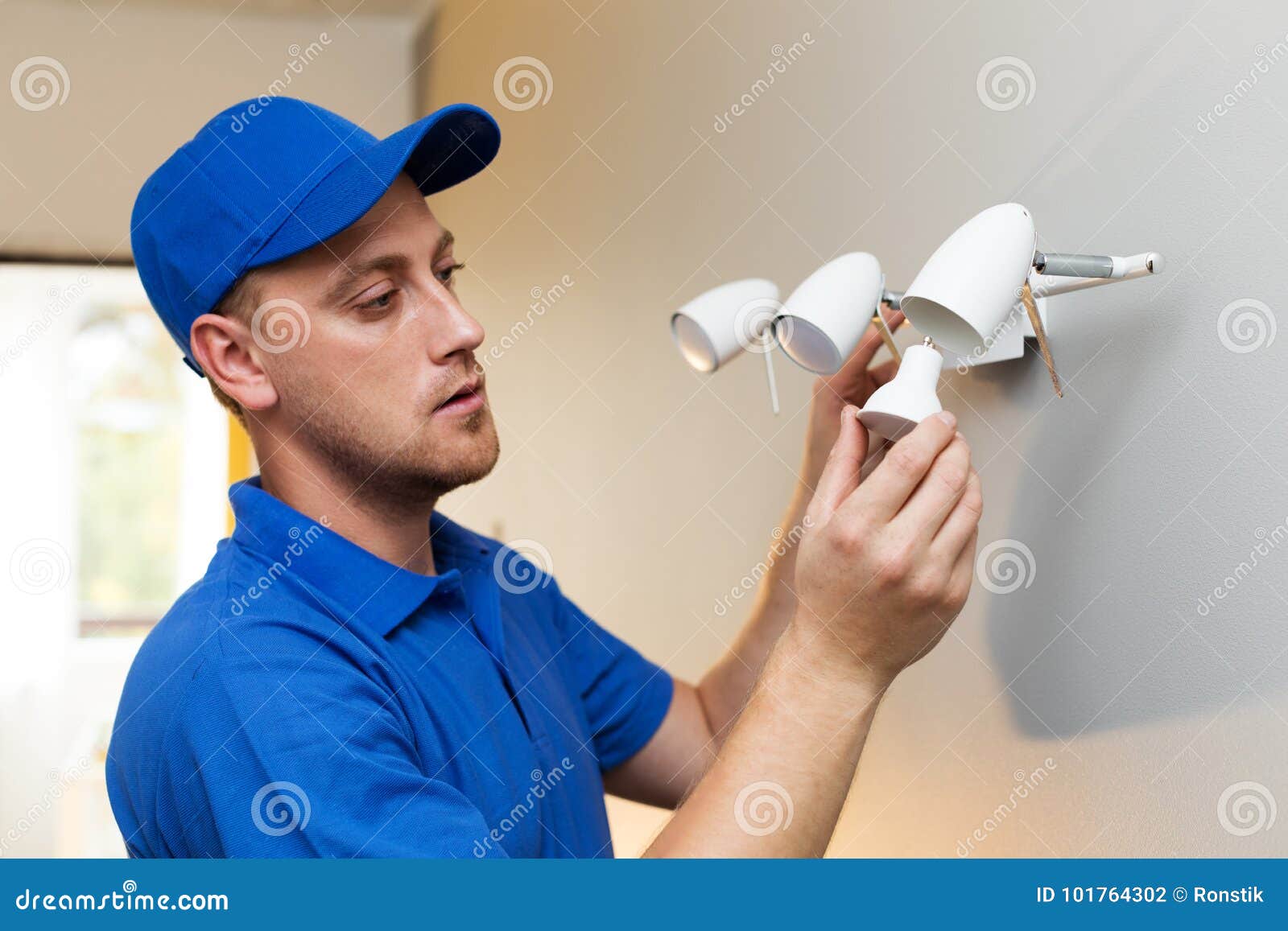 electrical maintenance - electrician change light bulb