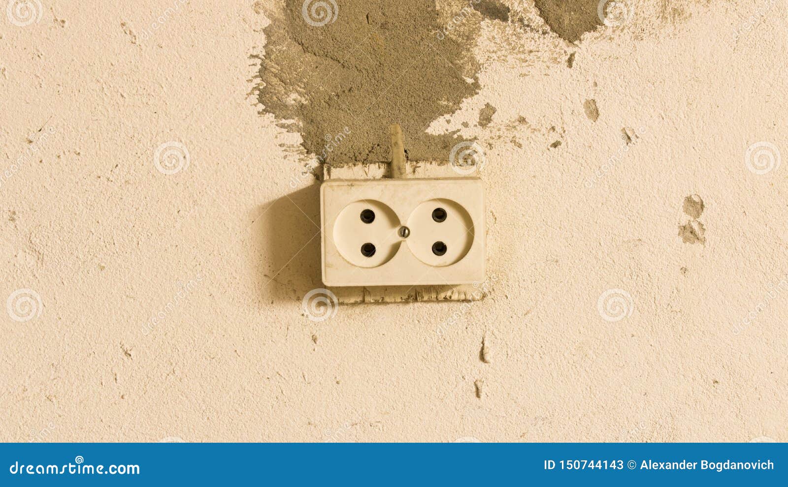 Electrical Outlet on the Old Concrete Wall. Isolated on Light