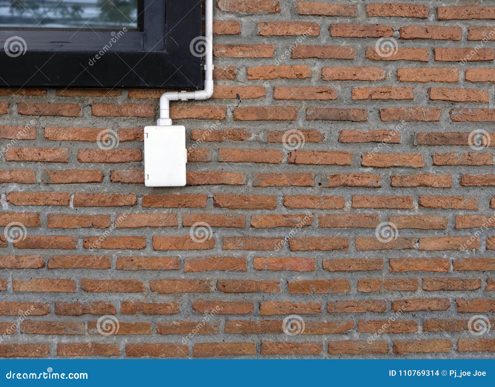 Power Outlets on the Brick Wall Vertical Orientation. Stock Photo
