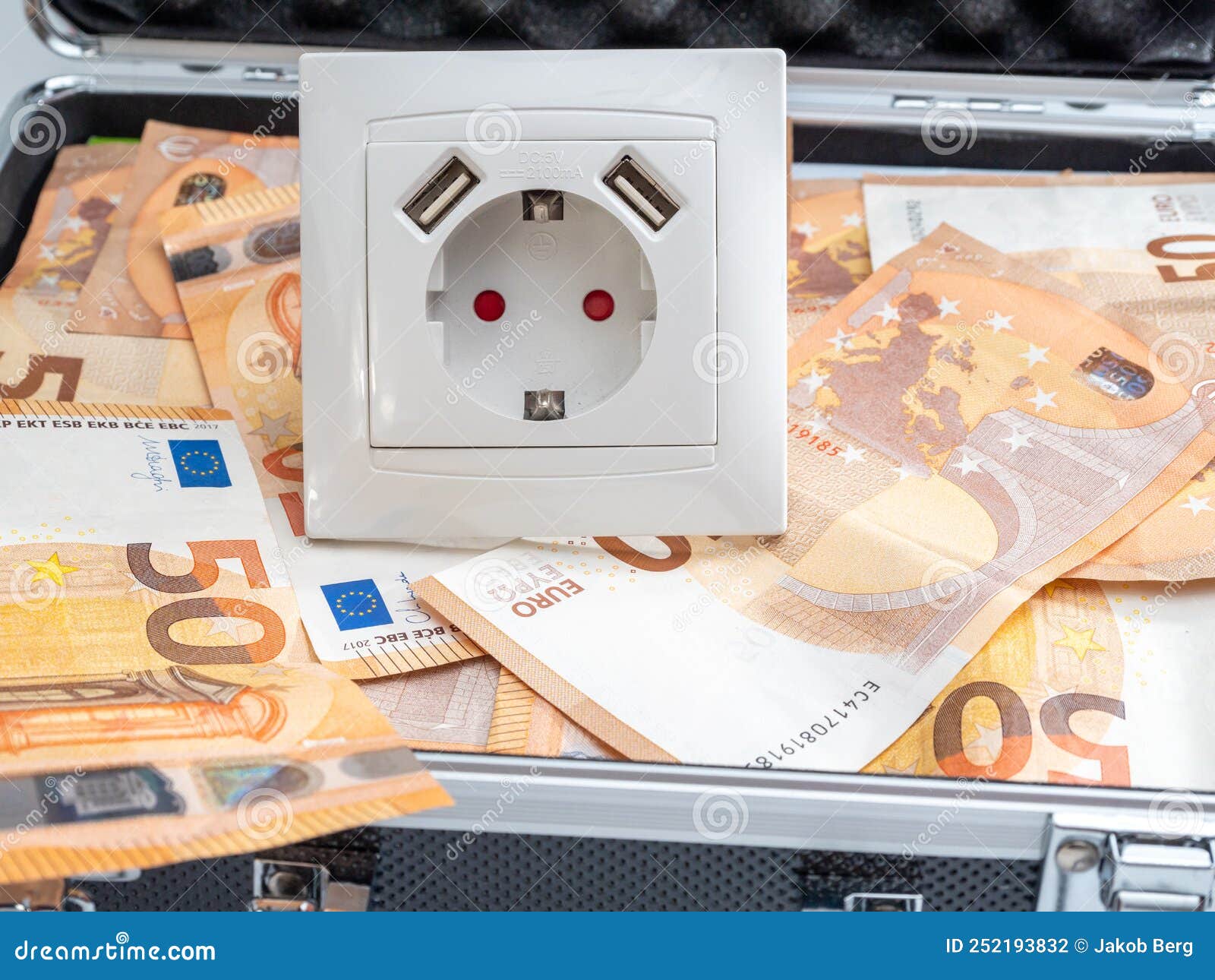 The Electrical Outlet is in a Suitcase with Money. Stock Photo Image