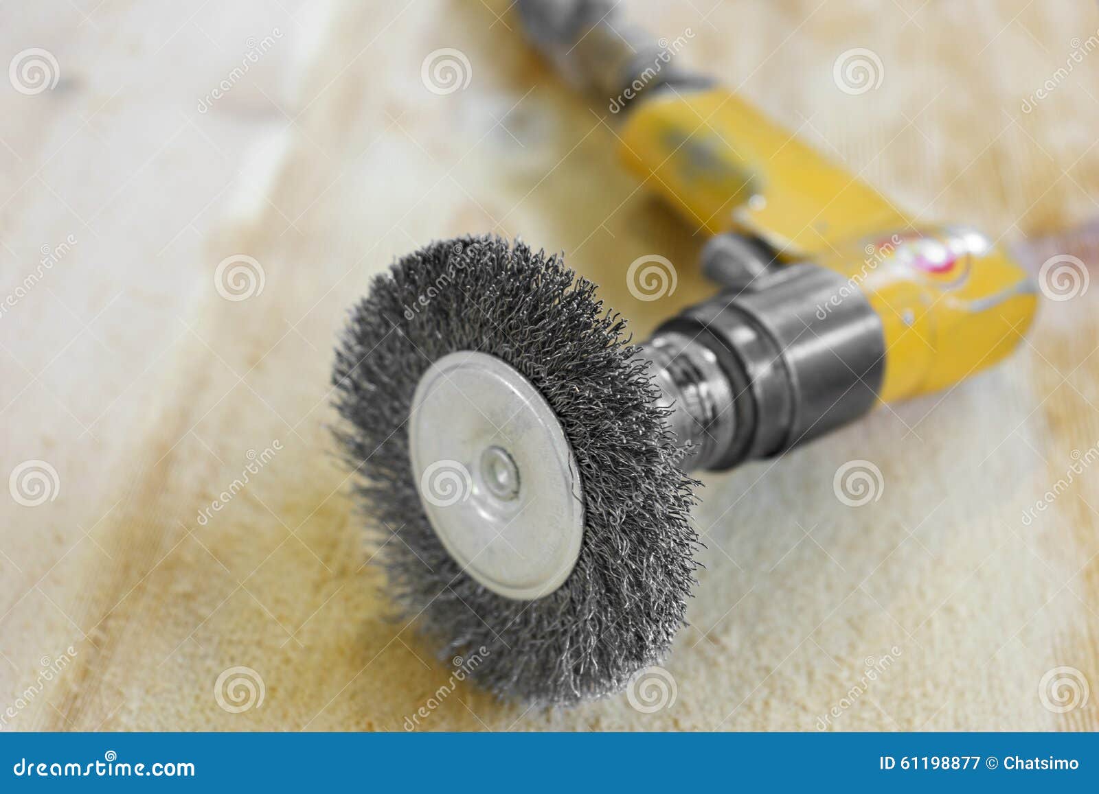 Electrical Rotating Brush Metal Disk Sanding Piece of Wood Stock Image