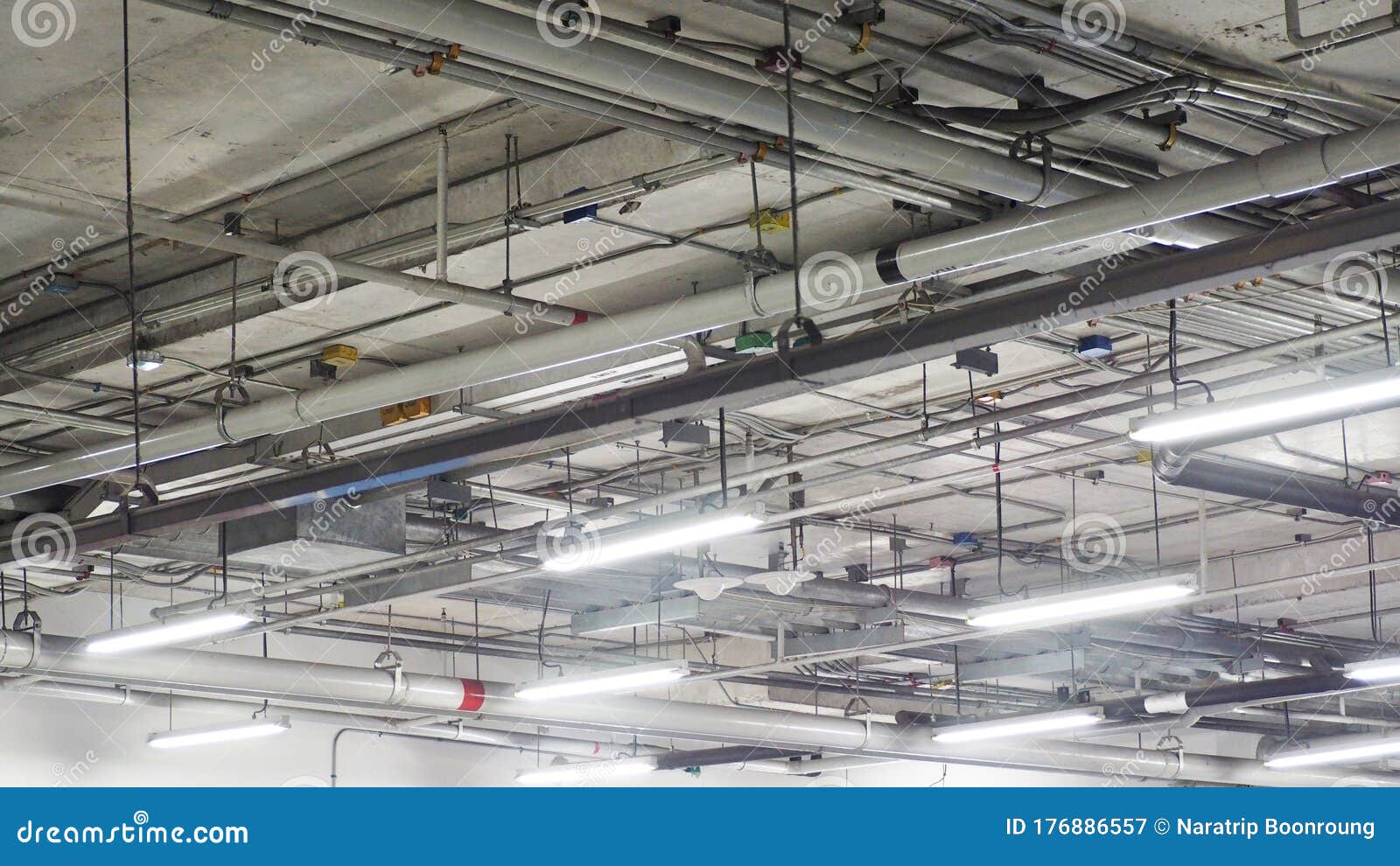 Electrical System Piping in the Building Under Bare Cement Plaster